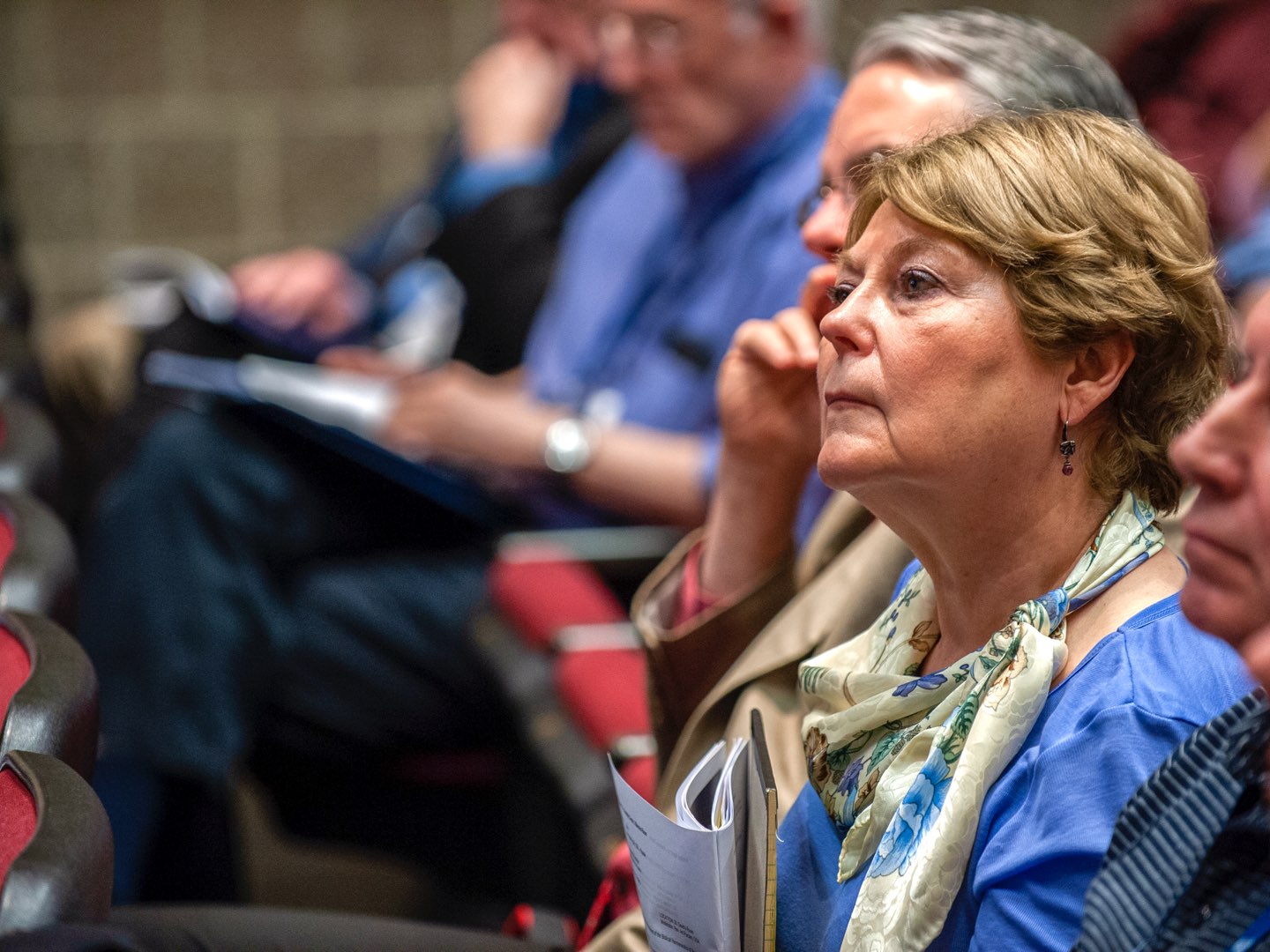 A woman listens to a talk at the conference.