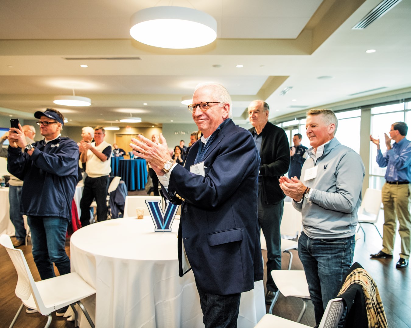 Villanova Class of 1976 alumnus Robert Byrnes, former Villanova University Alumni Association president, standing and clapping