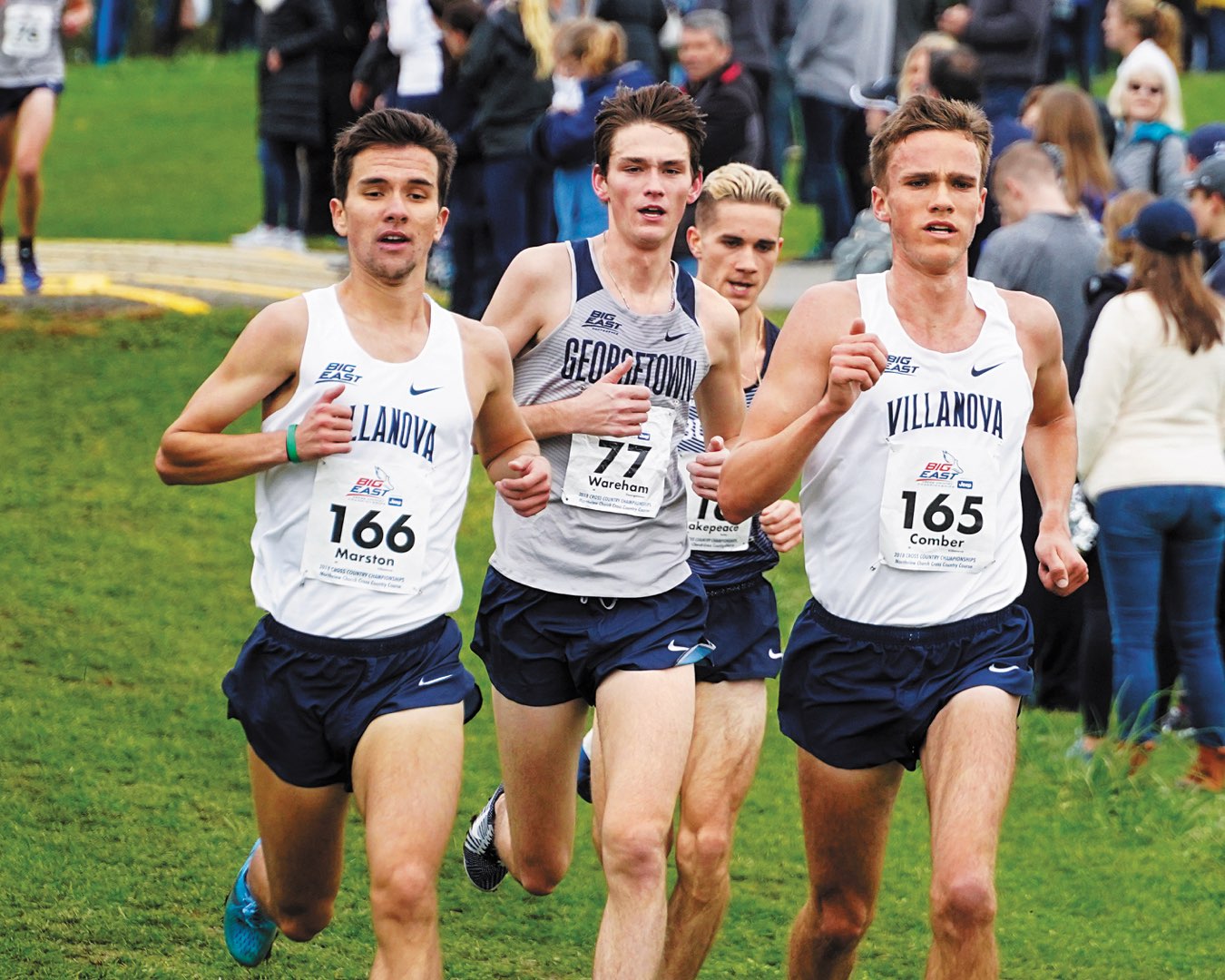 Two Villanova Men’s Indoor Track and Field team members running with two other runners close behind them