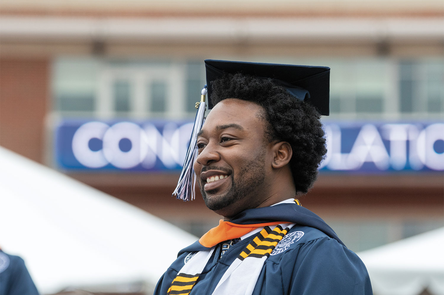 Male Villanova student wearing graduation robes.