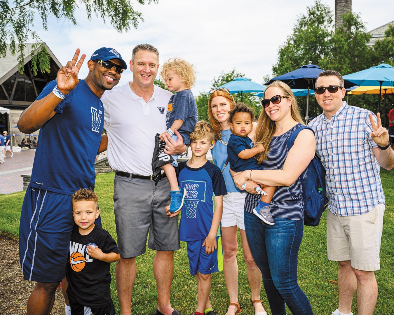 A group of alumni and their young children
