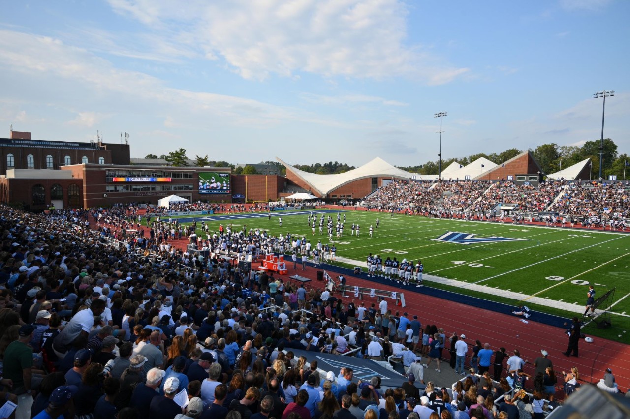 Fans watching a football game at Villanova Stadium