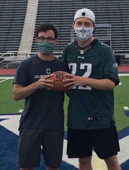 Two students posing for punt pass kick champs photo