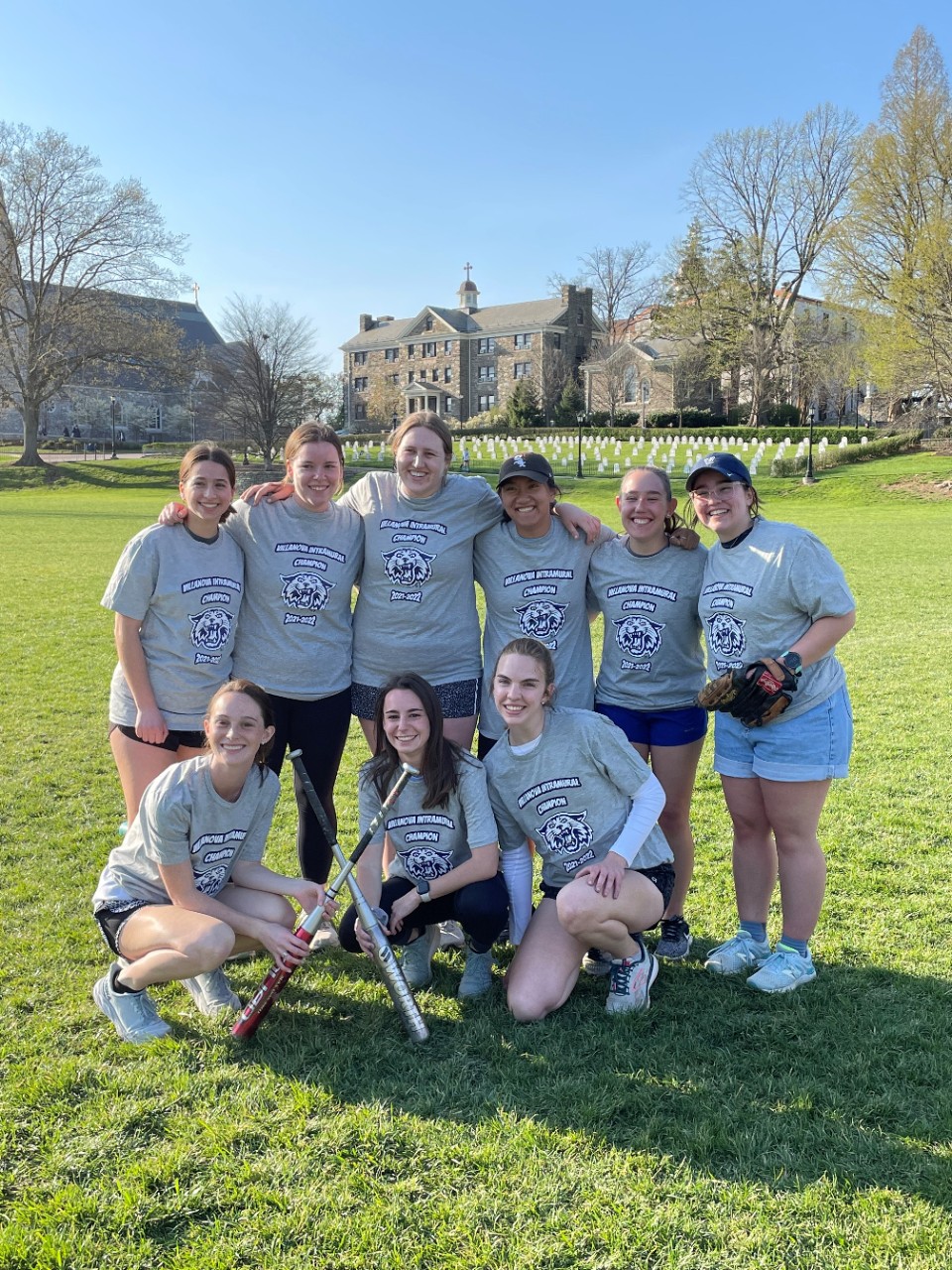Female students posing for softball champion photo