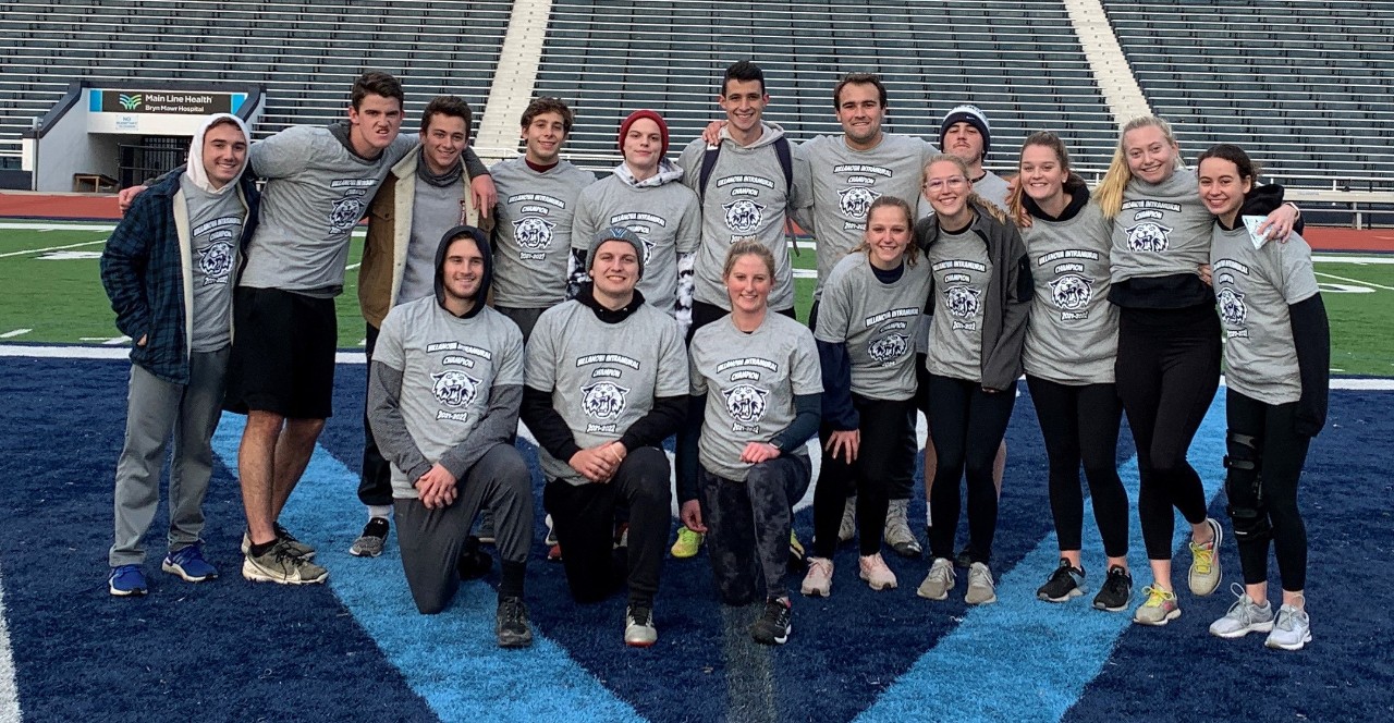 Students posing for flag football champion photo