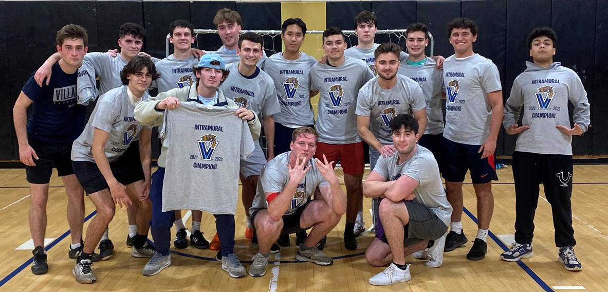 Male students posing for futsal champion photo