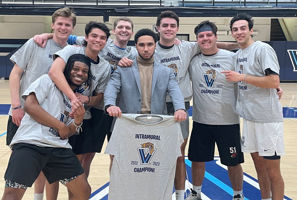 Male students posing for basketball champion photo