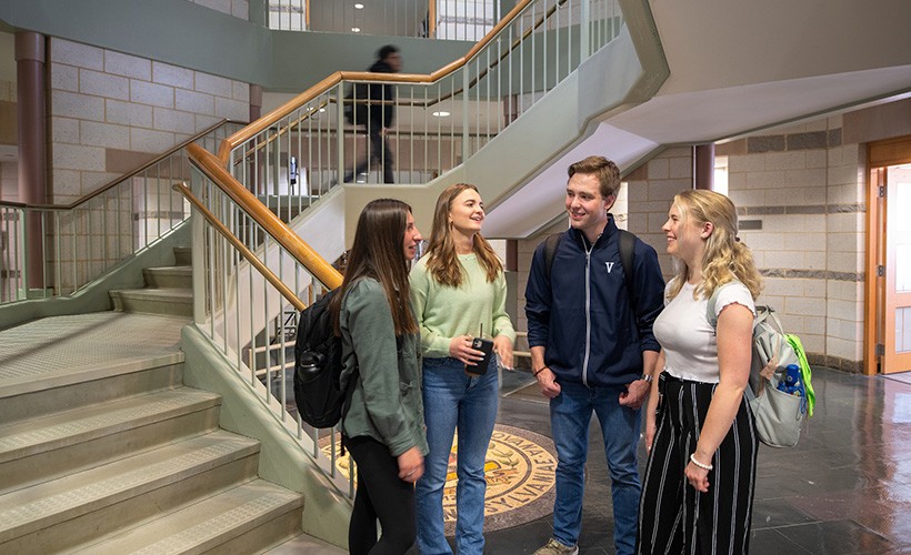 Students talk outside the Ellis Center in the St. Augustine Center.