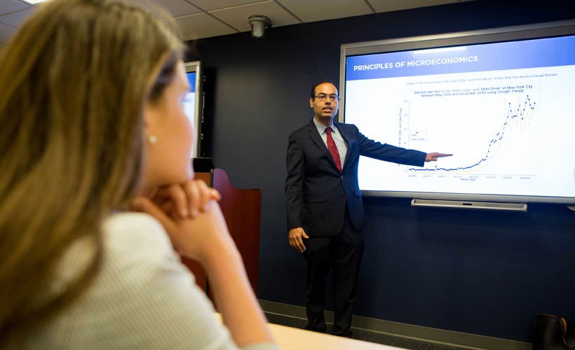 Economics Student listening to lecture.