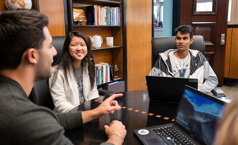 Students around a table.