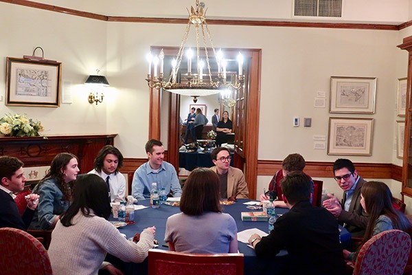 Students eat together at a Paideia Seminar. Students eat together at a Paideia Seminar.