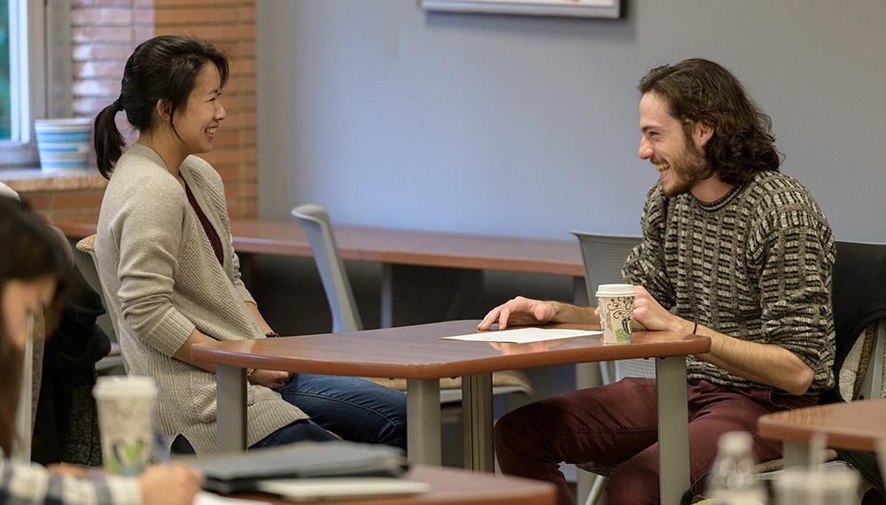 Graduate students working in the Writing Center