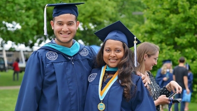 MPA Completion Rates Two Villanova MPA students in graduation caps and gowns