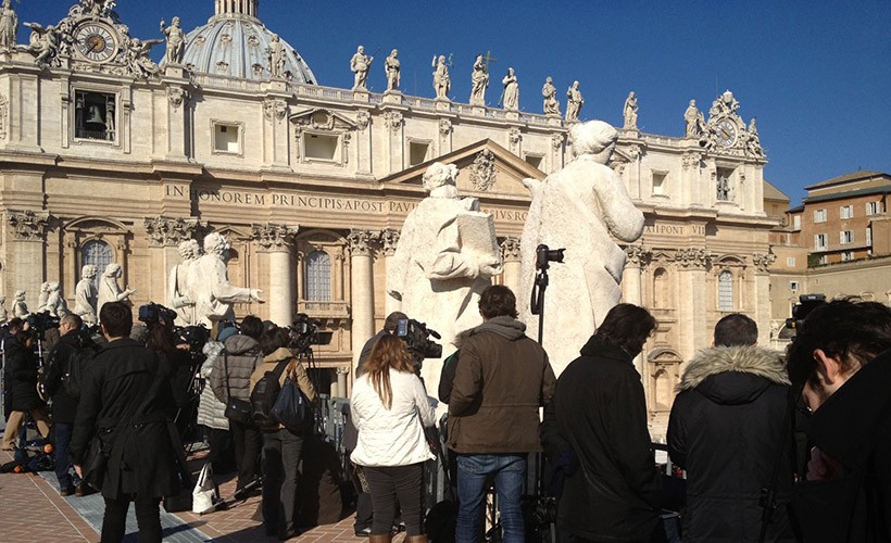 WFI Interns in Rome. image of interns in front of large ornate building with statues