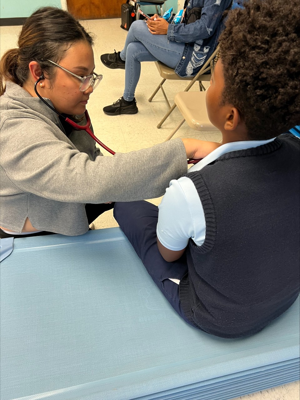 Deborah Toledo Batbatan, who is pursuing a postmasters certificate at FCN, conducted sports physicals for student-athletes. Deborah Toledo Batbatan, who is pursuing a postmasters certificate at FCN, conducted sports physicals for student-athletes.