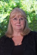 Helene Moriarty - greenery head shot size Dr. Helene Moriarty