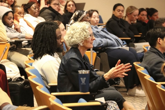 naratil-lecture A woman gesticulating in an audience