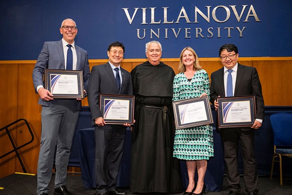 2024-faculty-scholars-awards 2024 Faculty Scholars Award honorees with University President the Rev. Peter M. Donohue, OSA