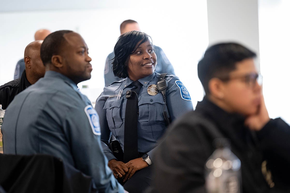 PSX333_20220111_0831 Public safety officers listening to someone speaking off camera