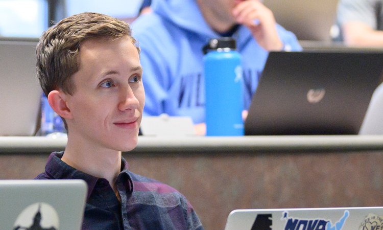 Student Sitting in Front of Computer