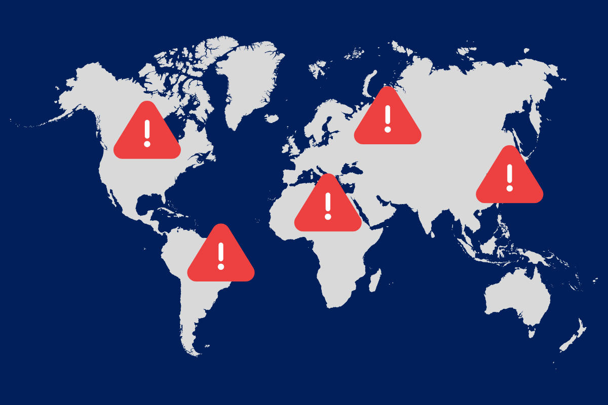 world map with several warning icons on top of the major continents