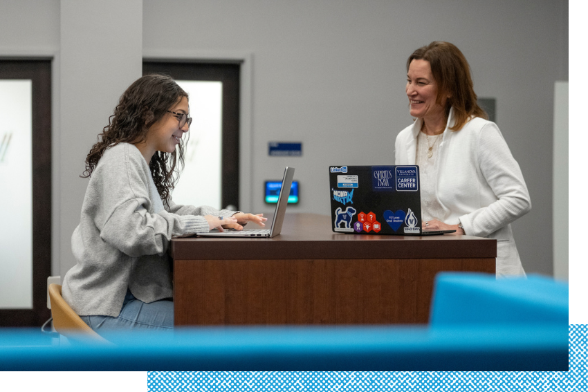 Students working with an advisor in the career center.