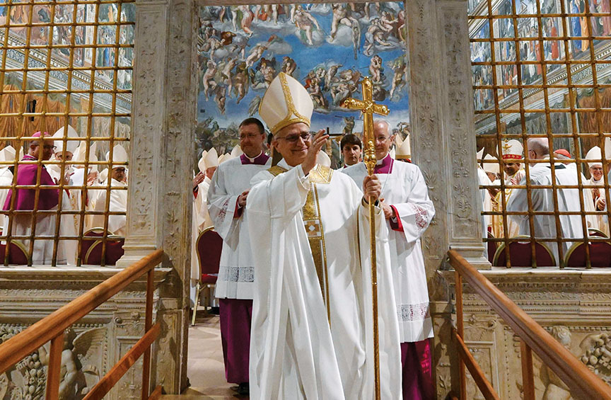 Pope Leo XIV in traditional vestments blesses the congregation as he processes out of the Sistine Chapel, with clergy behind him and Michelangelo’s The Last Judgment visible on the wall.