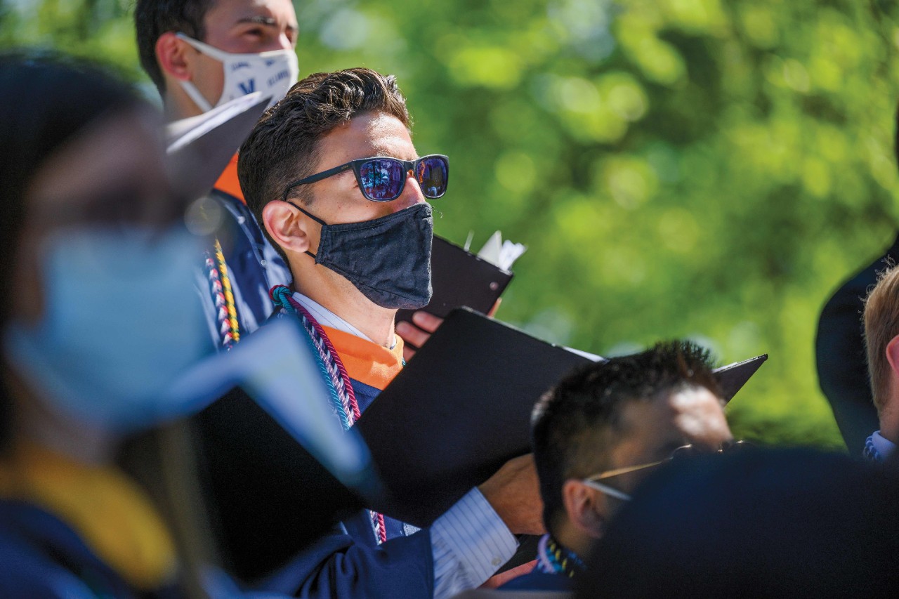 singer wearing sunglasses at commencement